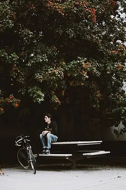 A child perched on the picnic table
