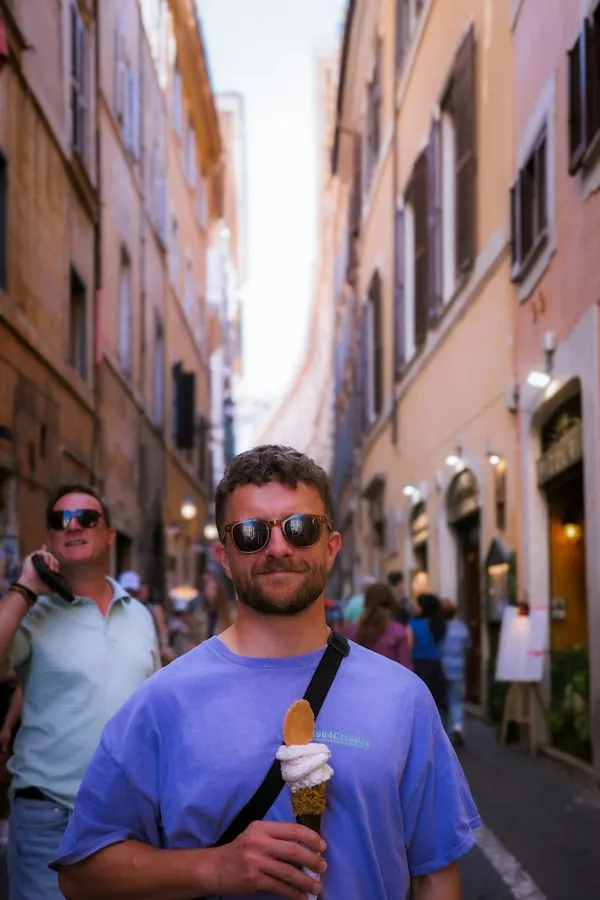 A man enjoying gelato in a Roman side street