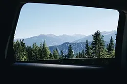 The road winding through green hills