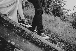 The newlyweds walking off in trainers